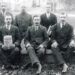 Vieni pirmųjų Anykščių savivaldos vadovų apie 1929 m. Priekyje kairėje su laikraščiu sėdi ilgiausiai tokias pareigas ėjęs Anykščių viršaitis Jonas Puodžiūnas, dešinėje – Anykščių miesto seniūnas Jonas Tutkus, vidurinis stovi valsčiaus sekretorius Donatas Gabia. N. Kopanso nuotrauka iš A. Baranausko ir A. Vienuolio-Žukausko memorialinio muziejaus rinkinių.