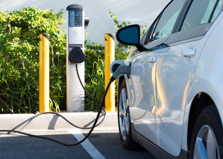 An electric car charging in California